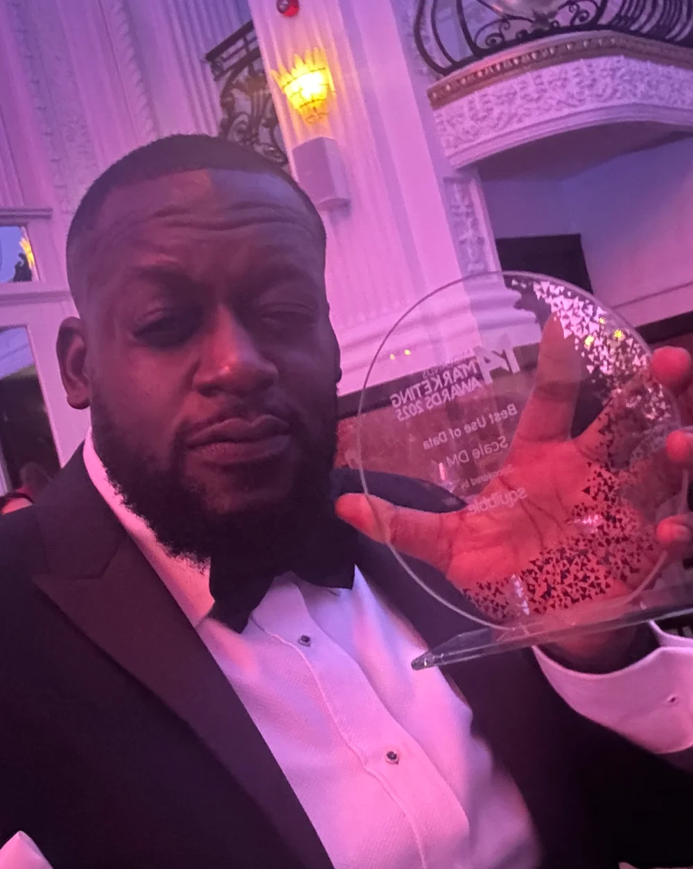 Darryl James holding the Best Use of Data award at the Midlands Marketing Awards 2025