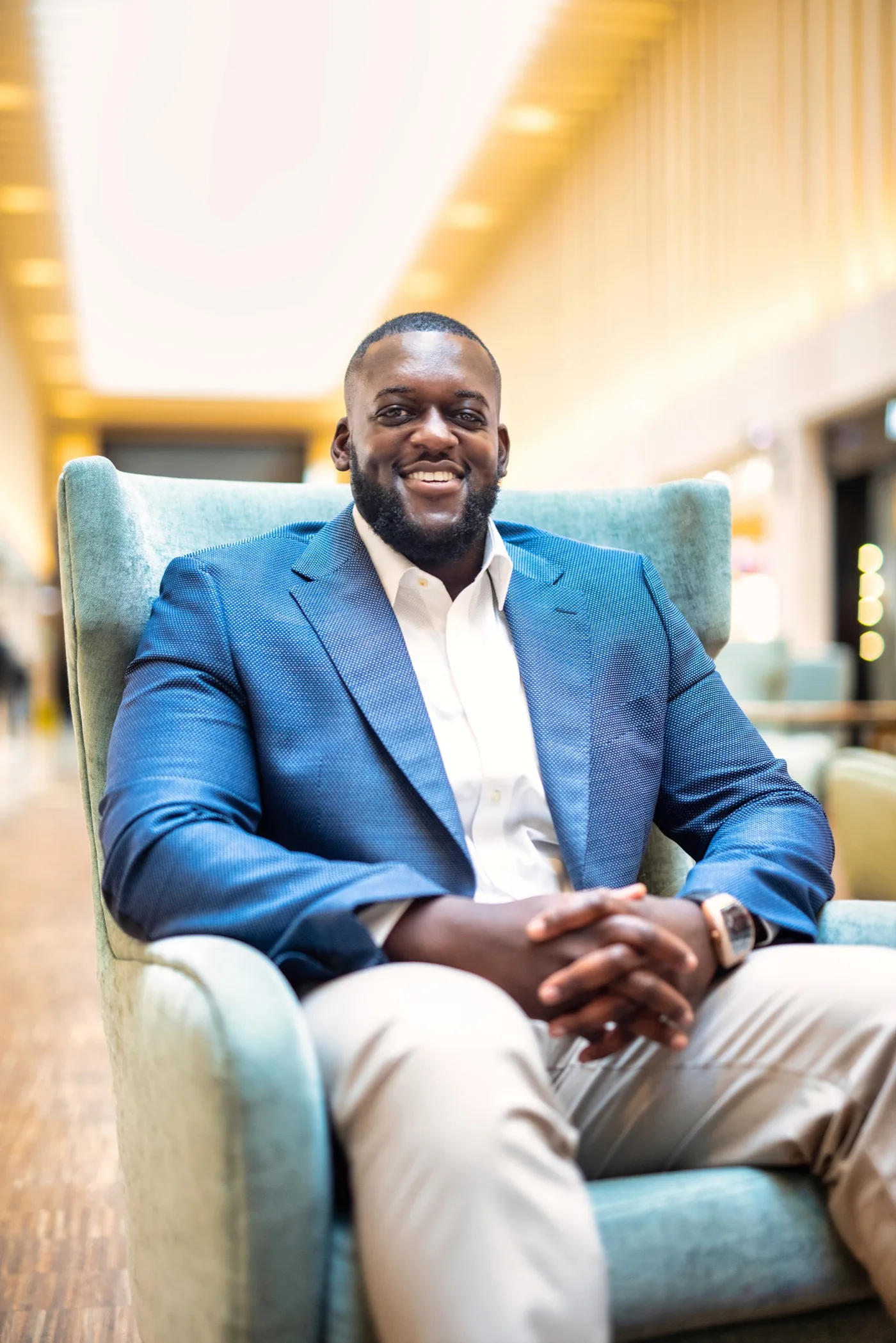 Darryl James seated in a blue jacket